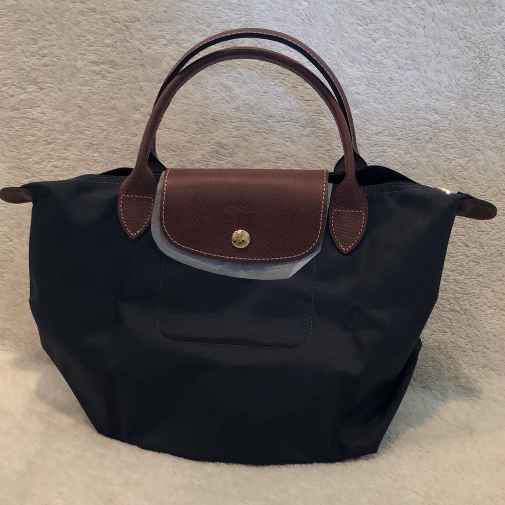 Small, new never used Longchamp purse.